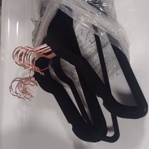 25 black velvety clothes hangers